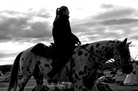 A Native youth rides a horse through the campsite just after sunrise at the DAPL Resistance camp in Cannon Ball, ND. Horses are a common sight around the camp and used primary for transportation.