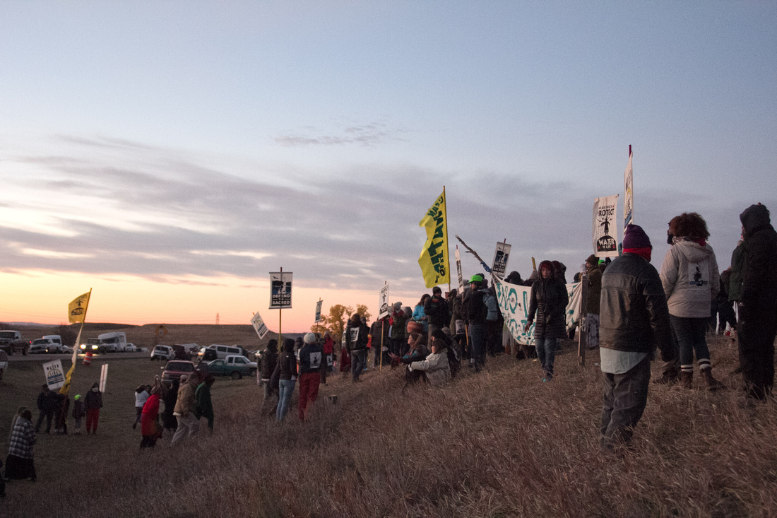 Native Americans and other DAPL Resistance members gather at sunrise for a 5 mile march to the DAPL construction site.