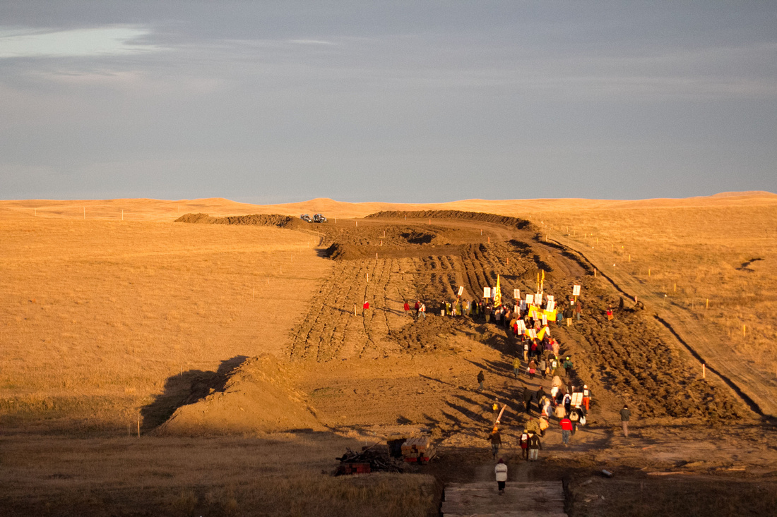 Native Americans and other DAPL Resistance members gather at sunrise for a 5 mile march to the DAPL construction site.