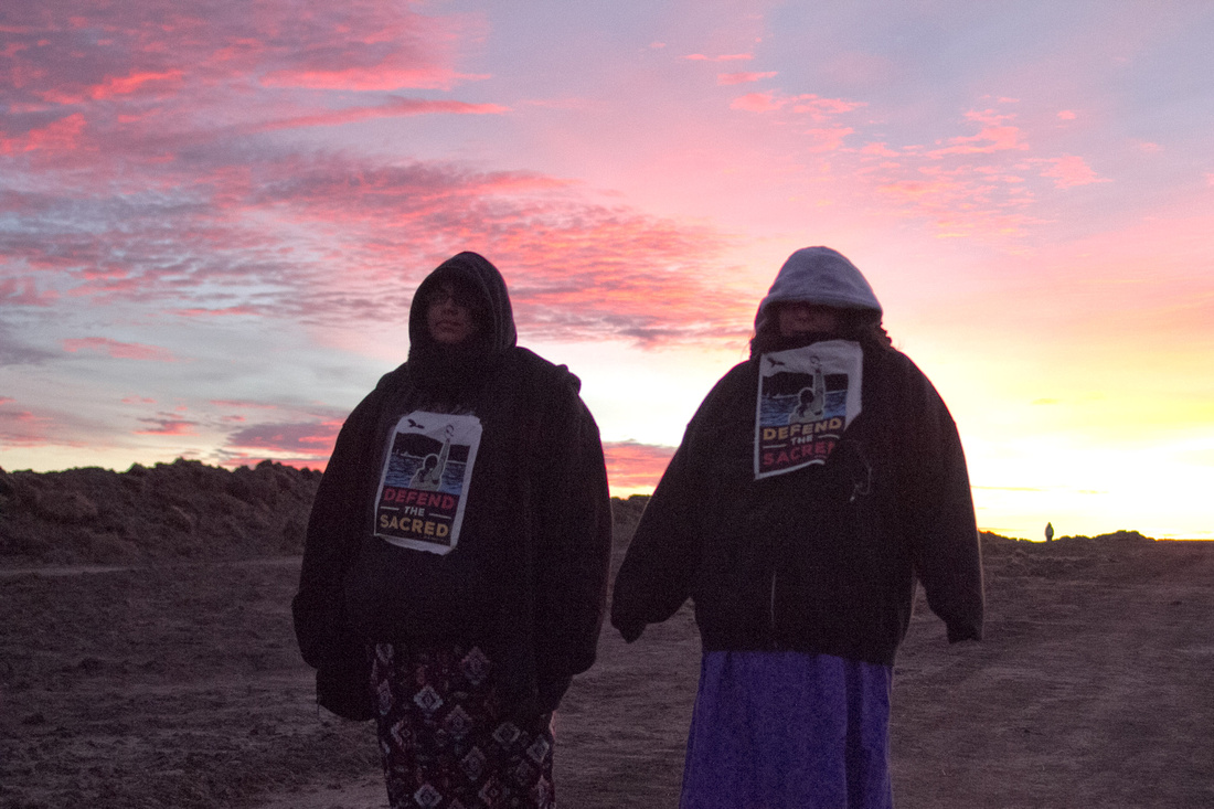 Native American Water Protectors at sunrise marching toward the DAPL construction site.